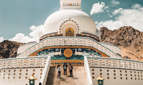 Buddhist temple in Ladakh, showcasing vibrant colors and intricate architecture, exuding tranquility and spirituality.